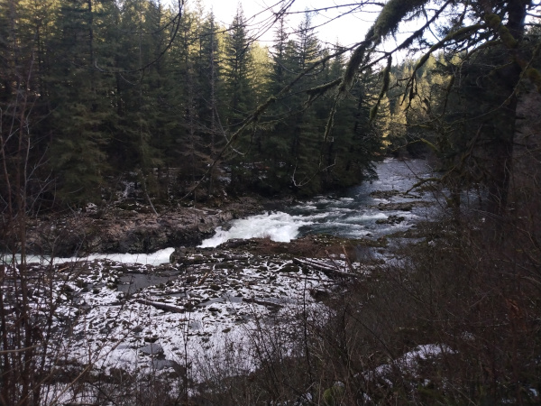 Whitewater over rocks dusted with snow
